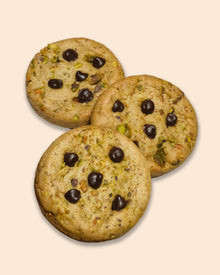 vegan pistachio chocolate cookie with roasted pistachios, pistachio butter, toasted kataifi, dark chocolate chips